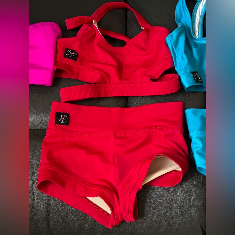 Child large. Red set and blue set. Adding pink and orange tops (no bottoms)